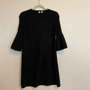 Black knit tunic dress with flutter sleeves.